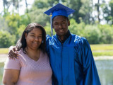 Mother and Son standing by lake